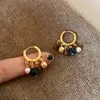 Nuevos Pendientes de Aro con Ojo de Tigre y Abalorios en Bloques de Color Estilo Chino para Mujer, Nuevos Populares 2025 Otoño e Invierno Accesorios Retro para Orejas