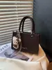 Bolsa quadrada pequena minimalista da moda transfronteiriça para mulheres, nova bolsa de ombro 2026, bolsa transversal versátil para o dia a dia, estilo popular