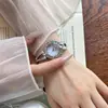 O relógio feminino redondo de quartzo mais vendido da Gedi com pulseira cravejada de diamantes, à prova d'água, estiloso e versátil, relógio de pulso feminino de nicho para o dia a dia.