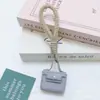 Huayang Bolsa Nueva Plaza Piel Sintética Mini Mochila Colgante Llave Joyería Accesorios Correa para Teléfono Móvil Billetera