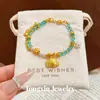 Tienda de oro mismo estilo arena dorada elefante pequeño DIY pequeña estrella de la suerte pulsera de cristal azul elefante en cuclillas de orejas grandes pulsera de cristal de elefante