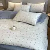 Bolso de mano jacquard estilo coreano juego de ropa de cama de cinco piezas, juego fresco y simple de cuatro piezas para uso doméstico, funda de edredón suave, disponible para venta al por mayor