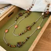 Aretes y Collar Maillard Vintage de Madera con Perlas de Cristal y Cadena para Suéter de Diseño de Nicho de Lujo Ligero, Juego de Joyería de Otoño e Invierno