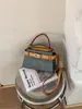 Moda Transfronteriza Versátil Gran Capacidad Primavera 2026 Nuevo Bolso de Hombro Cruzado de Moda con un Toque de Alta Gama y Bolso Cubo de Mano