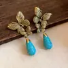 Brincos de tarracha plissados ovais com borboleta cravejada de diamantes e agulha de prata usados design retrô vintage brincos de nicho para mulheres