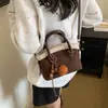 Bolso de axila retro de alta costura para mujer, nuevo modelo de invierno 2026, bolso de mano casual de gran capacidad, bolso tipo cubo, bolso de hombro