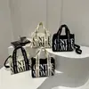 Bolsa de Lona com Estampa de Letras Simples e Única 2026 Nova Bolsa de Ombro Casual para Mulheres Delicadas