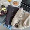 Chaqueta Suéter para Niños Primavera y Otoño 2026 Cárdigan para Niños Estilo Coreano Ropa de Punto para Niños Beige Ropa de Primavera para Bebé Moderna