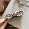Pinza para el pelo de plátano con lunares estilo coreano para mujer, versátil y simple, nuevo modelo 2026, moderno y elegante, pinza para el pelo de alto valor estético