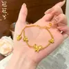 Conjunto de Duas Peças de Pulseira Dourada Areia e Colar de Borboleta, Venda Quente em Live-Stream, Alta Retenção de Cor, Joias de Luxo Leve para Mulheres, Latão Banhado a Ouro