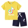 Camiseta infantil 2022 TikTok verano nueva ropa infantil de comercio exterior coreana pantalones cortos de manga corta para niños traje de dos piezas