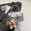 Estilo Coreano 2025 Verão Nova Bolsa de Ombro Feminina Design Distintivo Bolsa de Axila Moda Nicho Feminina Portátil Pequena Quadrada