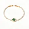 Pulsera de flor de cuatro pétalos de cristal para comercio exterior transfronterizo, versión coreana, lujo ligero, diseño de alta gama, accesorio de mano floral estilo Ins