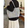 Bolso de lona de sarga a rayas estilo coreano, un bolso de hombro simple y versátil de gran capacidad, perfecto para uso casual y para ir al trabajo.