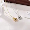 Collar de titanio y acero con diseño de nicho de circón microincrustado transfronterizo para mujer, cadena para clavícula de temperamento versátil, colgante de moda, venta al por mayor
