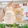 Popular de Internet Lindo Lindo Babero Colgante de Oso Peluche Muñeca Dibujo Animado Colgante de Bolsa Llavero Muñeca Muñeca