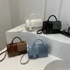 Bolso de Mano Pequeño de Color Contrastante Moda Retro al por Mayor 2025 Nuevo Bolso Cuadrado Pequeño Simple Versátil Bolso Cruzado con Textura