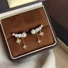 Pendientes Exquisitos de Borla y Flor de Cuatro Hojas con Perlas, Lujo Ligero Fresco y Elegante, Pendientes Nuevos Súper Elegantes de Verano 2026, Más Vendidos para Mujeres