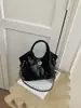 Bolso de mano vintage de alta gama para mujer, nuevo estilo primavera 2026, bolso cruzado y de hombro casual único y moderno