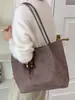 Bolsa tote casual de grande capacidade, cor sólida, nova versão coreana outono 2026, bolsa de mão e bolsa de ombro personalizadas para trabalho e deslocamento