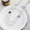 NK-227 Collar de camelia hueca en blanco y negro, collar de perlas de vidrio hecho a mano, cadena de suéter larga para mujer, otoño e invierno, nuevo