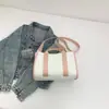 Moda Nova Primavera 2026 Estilo Coreano Ins Grande Capacidade Portátil Lona Roupas de Trabalho Bloqueio de Cores Bolsa Tote Casual de Ombro Único