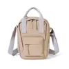 Bolso cruzado casual estilo japonés para mujer, mochila mini multifuncional nueva, bolso de hombro versátil para teléfono para el día a día, venta al por mayor
