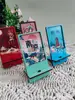 Tide nacional talla de madera soporte para teléfono móvil atracciones creativas regalos creativos impresión a color soporte de escritorio para teléfono móvil venta al por mayor