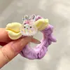 Coloridos coleteros de nuevo estilo 2026, versátiles y dulces, con accesorios de M&M's, anillos de toalla, diseños de dibujos animados y un estilo fresco y lindo, perfectos para accesorios para el cabello de niños