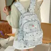 Mochila escolar para estudiantes de secundaria femeninas, mochila decorativa con adornos de encaje para niñas, bolsa ligera casual de doble hombro, protectora de la columna vertebral y reductora de carga