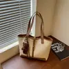 Bolso de hombro tipo tote tejido de gran capacidad transfronterizo para mujer, nuevo y moderno patrón tejido de otoño 2026, versátil