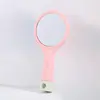 Pente de almofada de ar para atacado de fábrica com espelho pequeno no verso pente de cabelo para meninas cor Macaron pente de airbag portátil