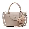 Venta Directa de Fábrica Bolso de Mano de Alta Gama a la Moda para Mujer 2026 Nuevo Estilo de Tendencia Más Vendido con Patrón de Lichi Bolso de Hombro Único Cruzado