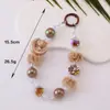Cadena para teléfono de gato con pompón y cuentas para otoño e invierno, accesorio de muñeca moderno, accesorio para funda de teléfono de mujer, colgante llavero para bolso