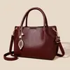 Bolso de mano para mujer 2026 nueva moda simple para mamá de mediana edad bolsa de gran capacidad multi-compartimento cuero suave bolsa para el día a día