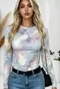 Camiseta feminina de gola redonda e manga longa com estampa floral em aquarela, estilo europeu e americano, elástica, justa ao corpo, versátil e perfeita como camada base.
