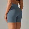 Pantalones de yoga de estilo nuevo sin línea de vergüenza color piel para mujer, cintura alta, realce de glúteos, compresión abdominal, shorts deportivos de tres puntos