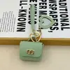 Mini bolsa de presente simples pode guardar fones de ouvido e chaveiros, bolsa de fone de ouvido de cor sólida, pingente de couro, bolsa quadrada criativa, bolsa longa