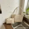 Bolsa de playa tejida hueca de venta caliente para mujer, nuevo modelo 2026, bolso de hombro exquisito, bolsa de playa casual para vacaciones