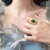 Anillo vintage occidental imitación oro arena perla artificial proceso de oro de estaño hueco vidrio verde proceso de moneda europea