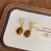 Pendientes de Ojo de Tigre Maillard Otoño e Invierno para Mujer, Pendientes de Botón Elegantes con un Toque de Lujo, Lujo Ligero, Nuevos Accesorios Populares para Orejas 2026