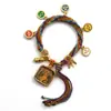 Pulseira do deus da riqueza de cinco vias estilo Xizang oito santos padroeiros cinco mestres Manjushri deus da riqueza amarelo thangka corda tecida à mão pulseira do ano desta vida
