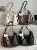Mochila de viaje para commuting de gran capacidad, nuevo estilo verano 2026, bolso de hombro personalizado, bolso liso para mujer de alta apariencia