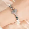 Conjunto de Três Cores de Zircônia Europeu e Americano Mais Vendido na Fronteira Pulseira com Corrente de Pérolas e Pingente de Elefante Cravejado com Diamantes de Designer para Mulheres