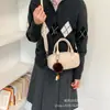 Bolso Almohada Retro para Mujer 2026 Nuevo Estilo Bolso de Mano Cruzado de Nicho de Alta Gama Bolso de Bolos para el Trabajo y el Trayecto Simple
