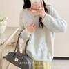 Tejido de punto floral estéreo reductor de edad francés para mujer 2025 Nuevo otoño e invierno Holgado de alta gama Suave tipo cera Top