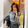 Top elegante de cuello redondo estilo coreano para primavera y otoño con mangas abullonadas y entallado en la cintura, suéter de punto liso hueco de invierno para mujer