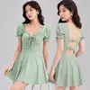 Traje de baño falda anti-exposición con volantes y lazo frontal, dobladillo de falda grande adelgazante, traje de baño de una pieza verde y negro para mujer, en stock