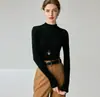 Suéter ajustado de cuello alto 100% lana para mujer, nueva camiseta básica de punto de color liso para otoño e invierno, top suéter adelgazante