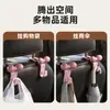 Vendido directamente por el fabricante, Lindo gancho con forma de lazo para respaldo de asiento de coche, Decoración de coche multifuncional Dopamina